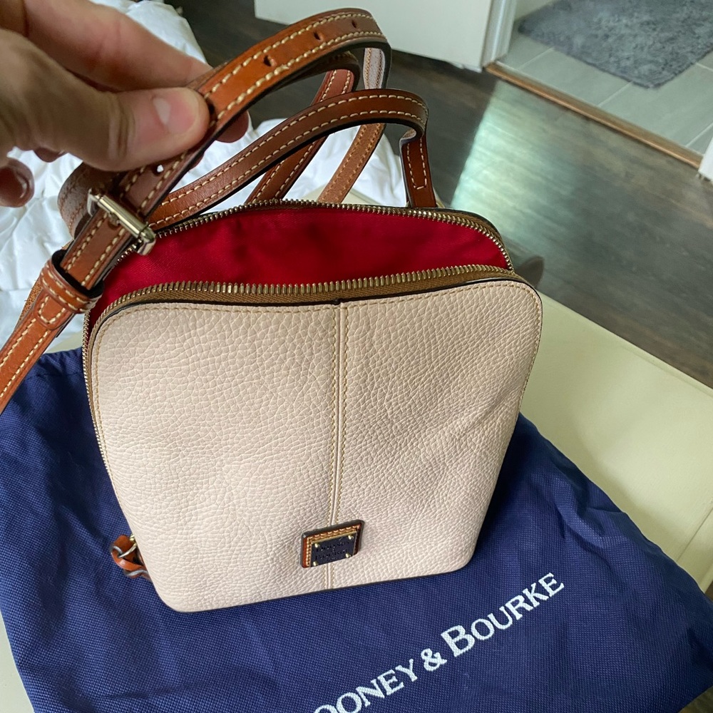 Dooney & Bourke light beige or cream color crossbody bag